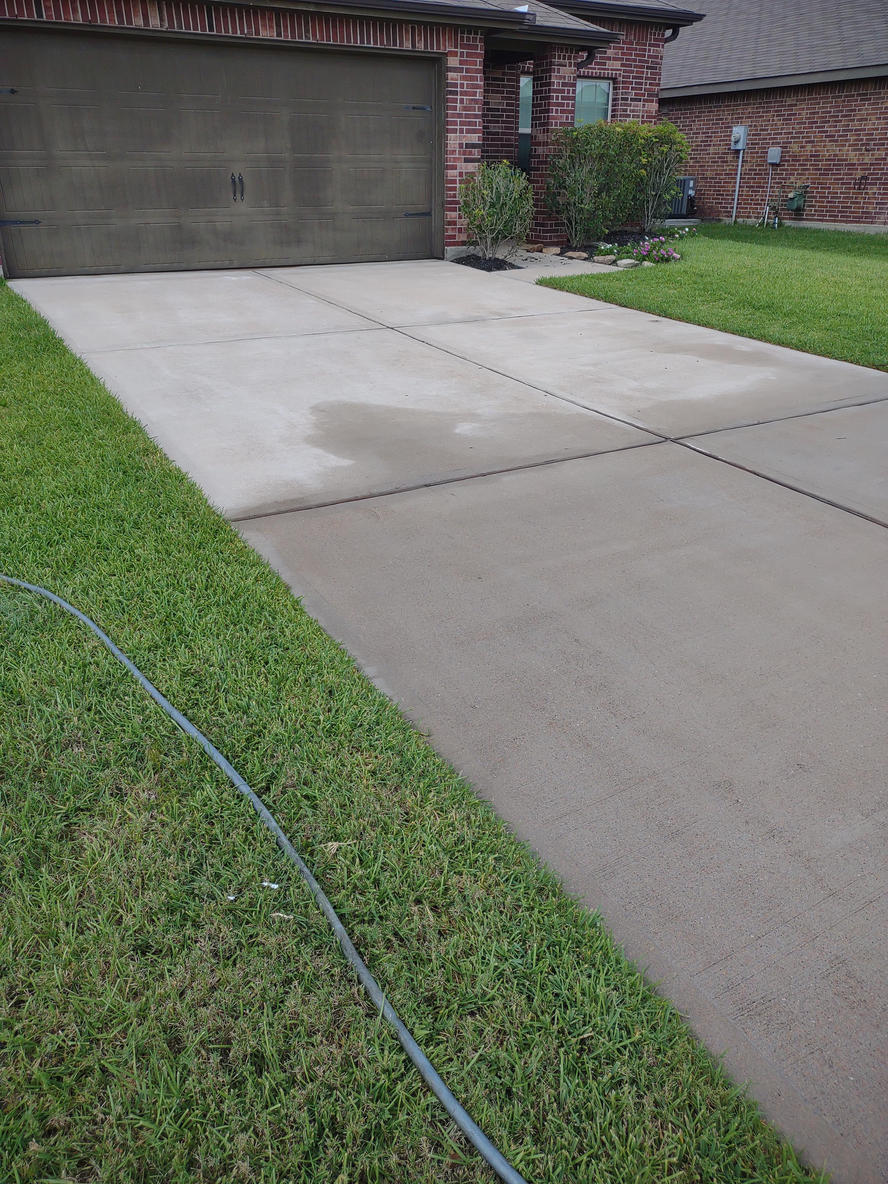 Driveway after professional pressure washing — clean concrete in Cypress TX